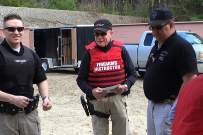 Bruce Blessington on the firing line observing police officers' rifle practice.